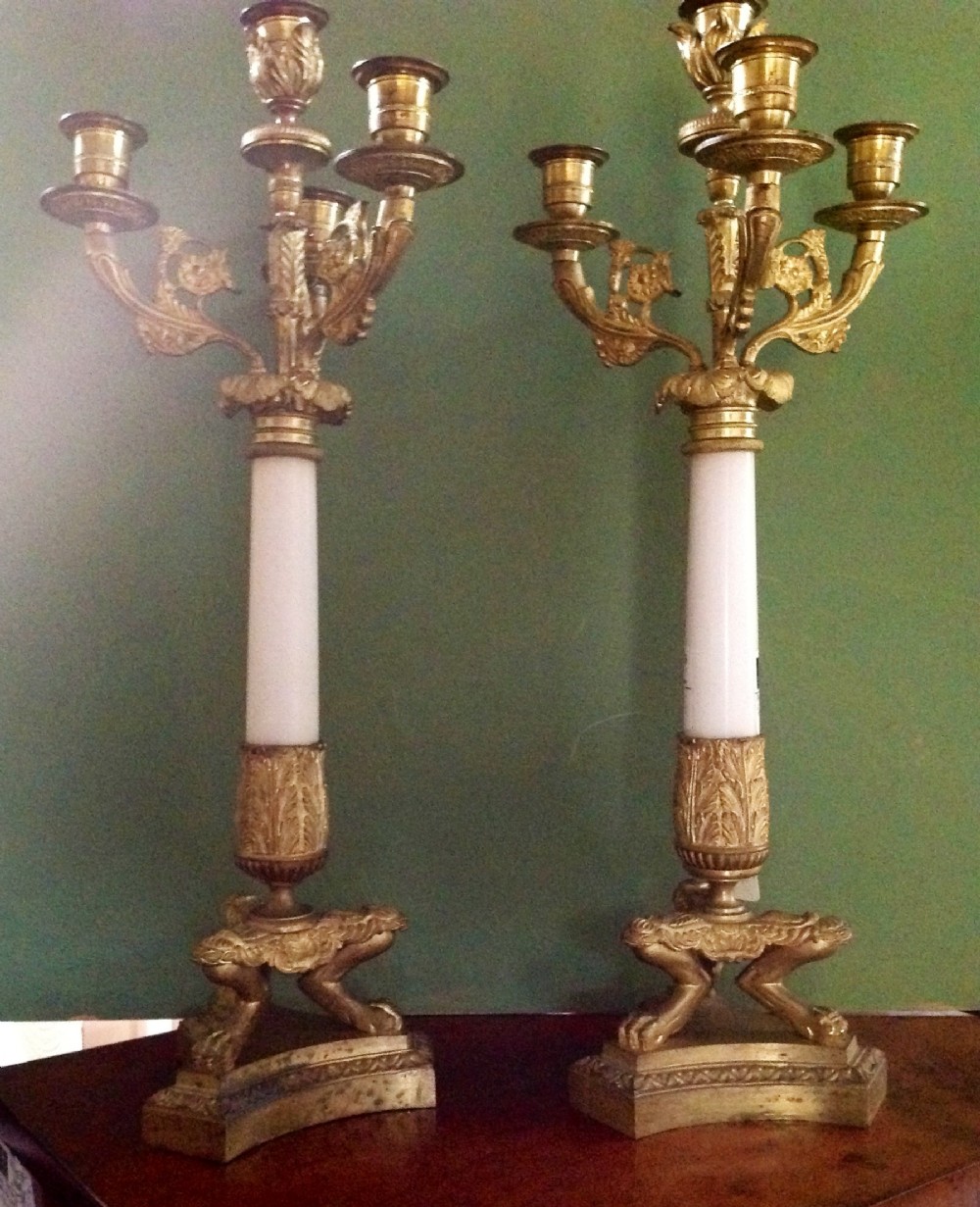 pair of c19th french empirestyle ormolu bronze and white marble candelabras