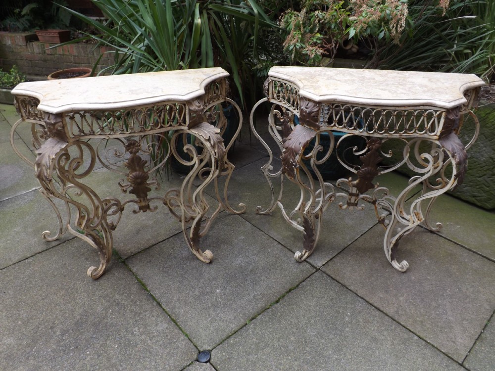 pair early c20th french marbletopped wrought iron console tables