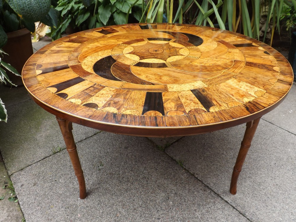 early c19th circular top specimenwood veneered table on low base