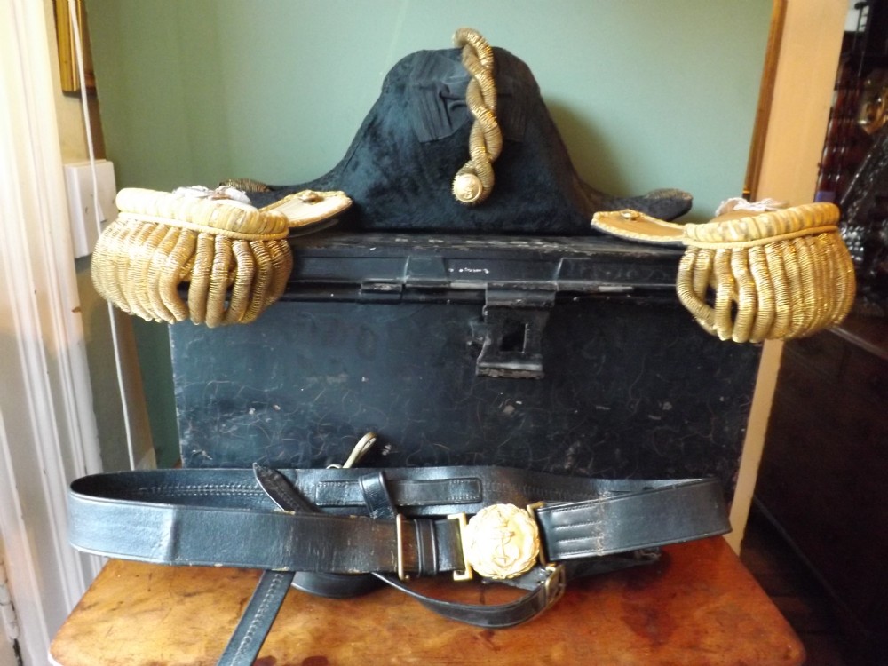 early c20th royal naval officer's bicorn hat epaulettes and swordbelt in a fitted service tin