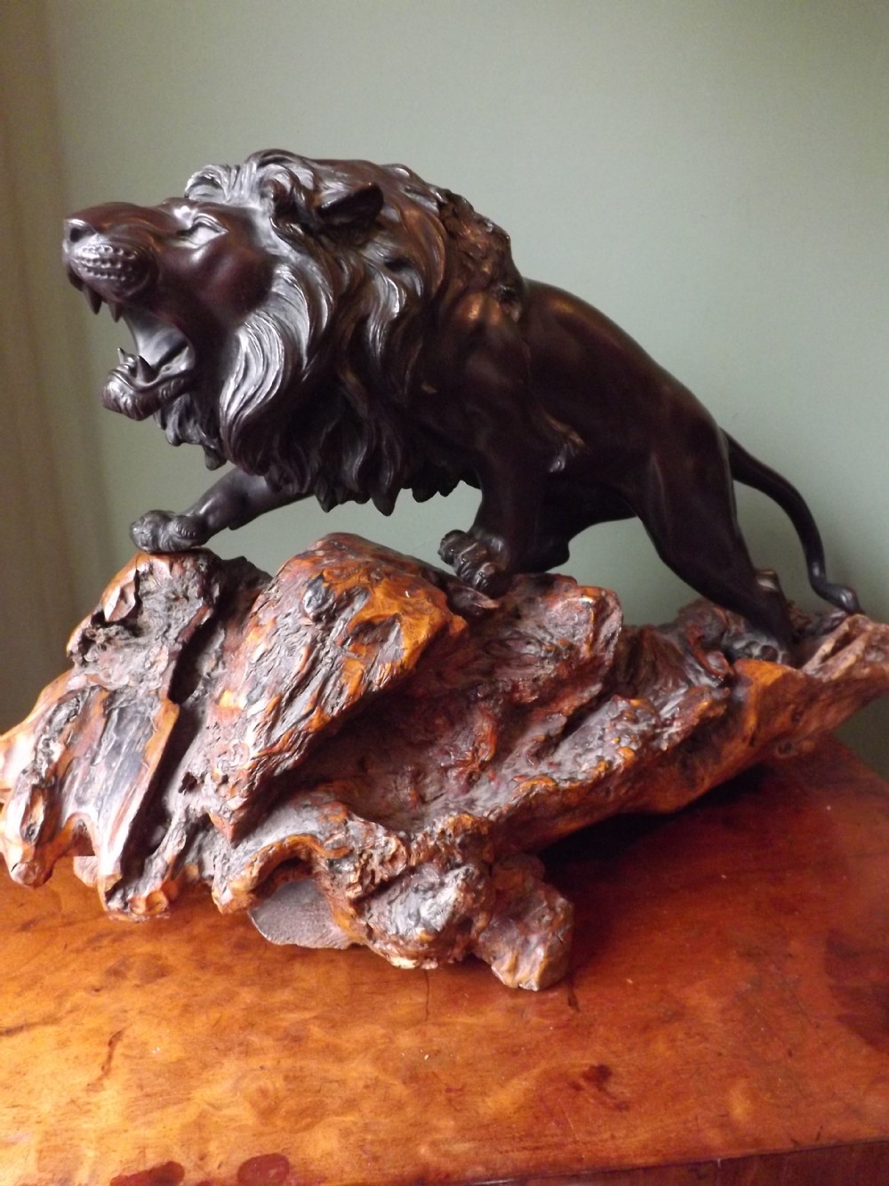 late c19th japanese patinated bronze lion study on carved rootwood stand
