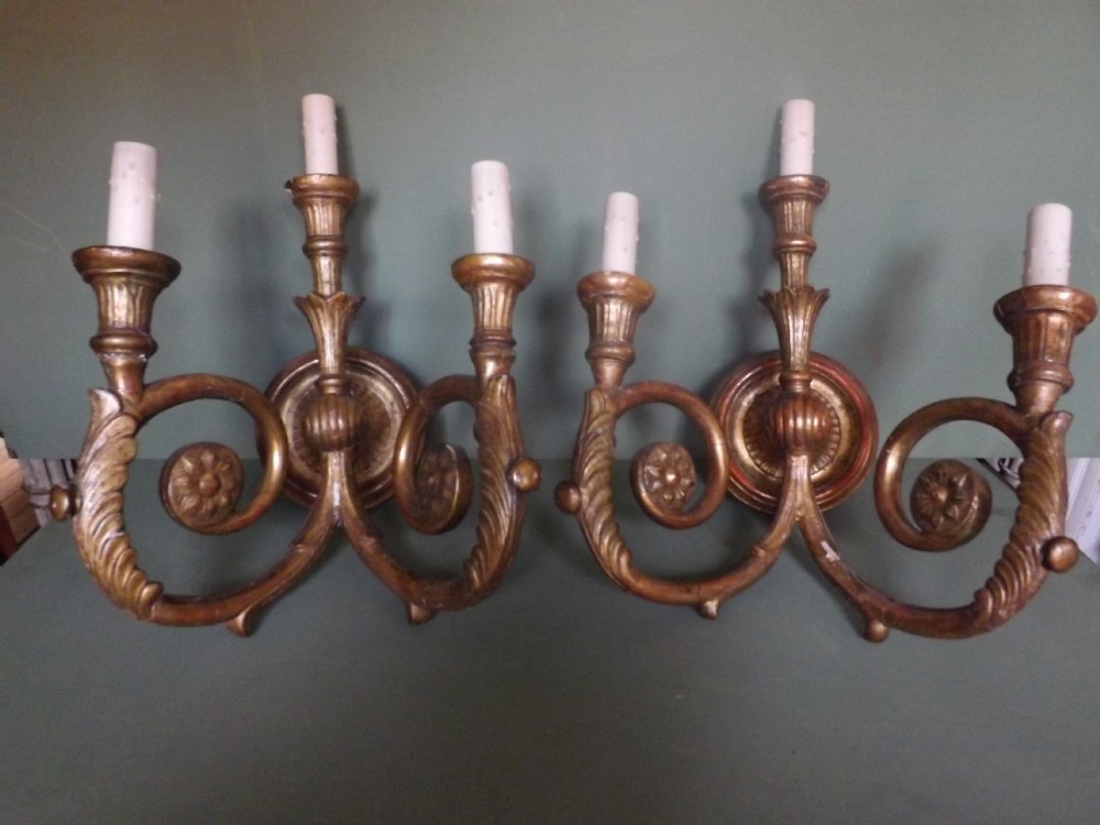 pair of early c20th italian carved giltwood 3 branch walllights