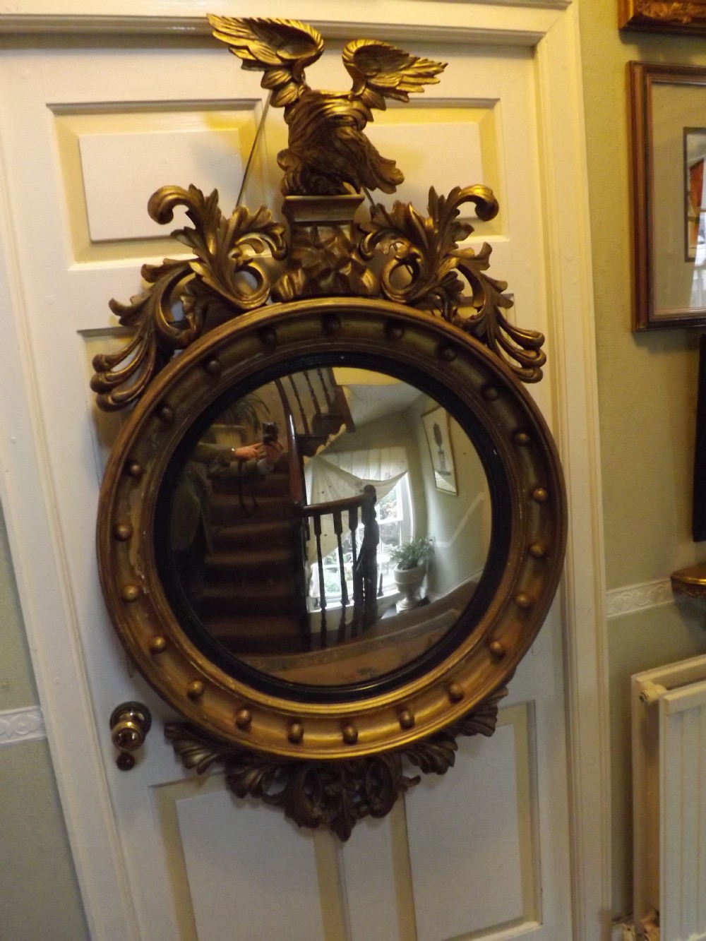 early c19th regency period carved giltwood framed convex mirror