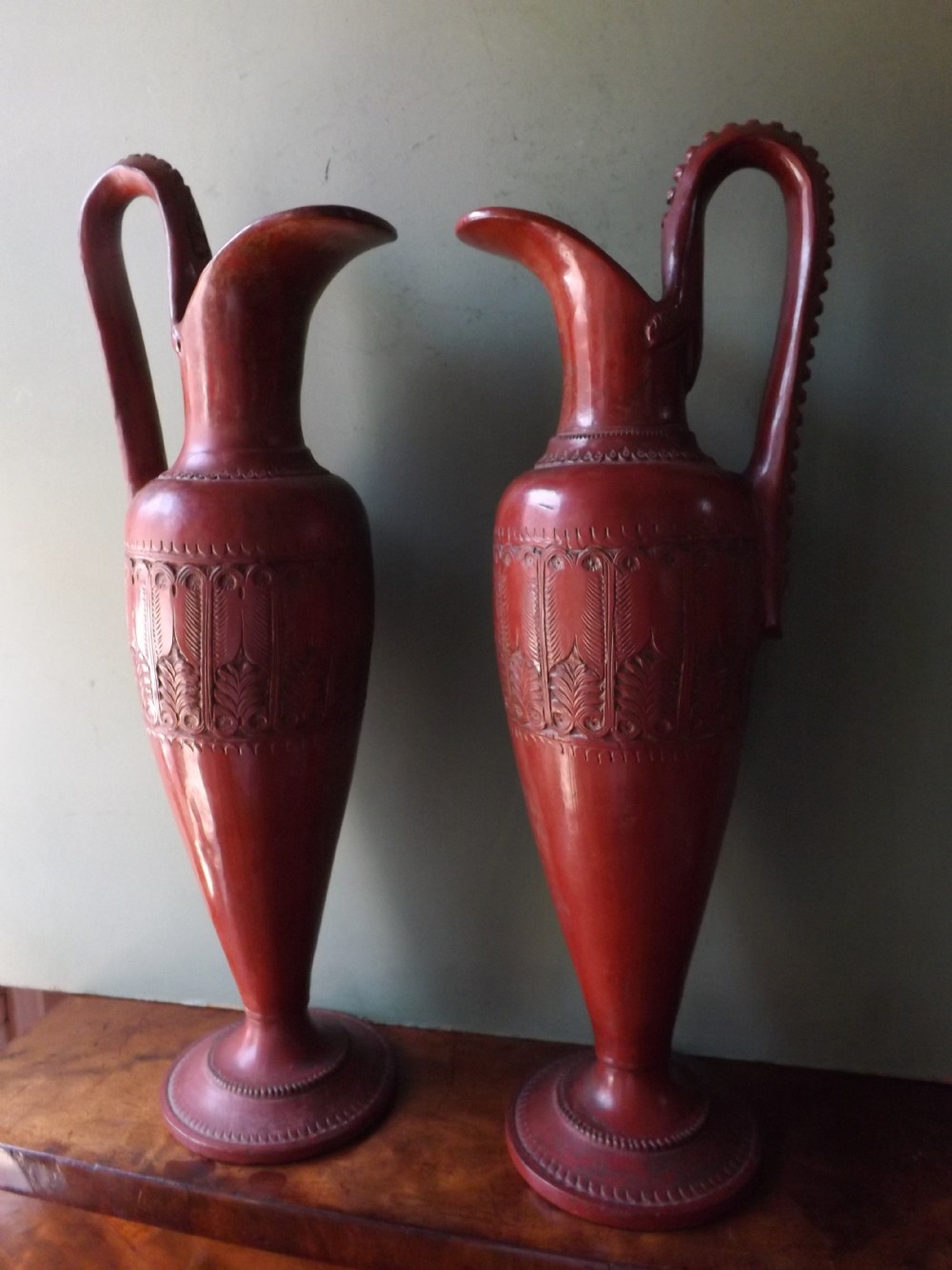 pair of c19th 'redware' pottery ewers after the antique in ancient greek style