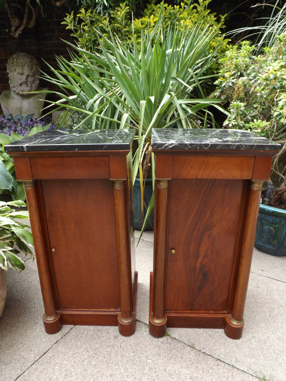 pair of early c20th french empirestyle mahogany marbletop bedside cupboards