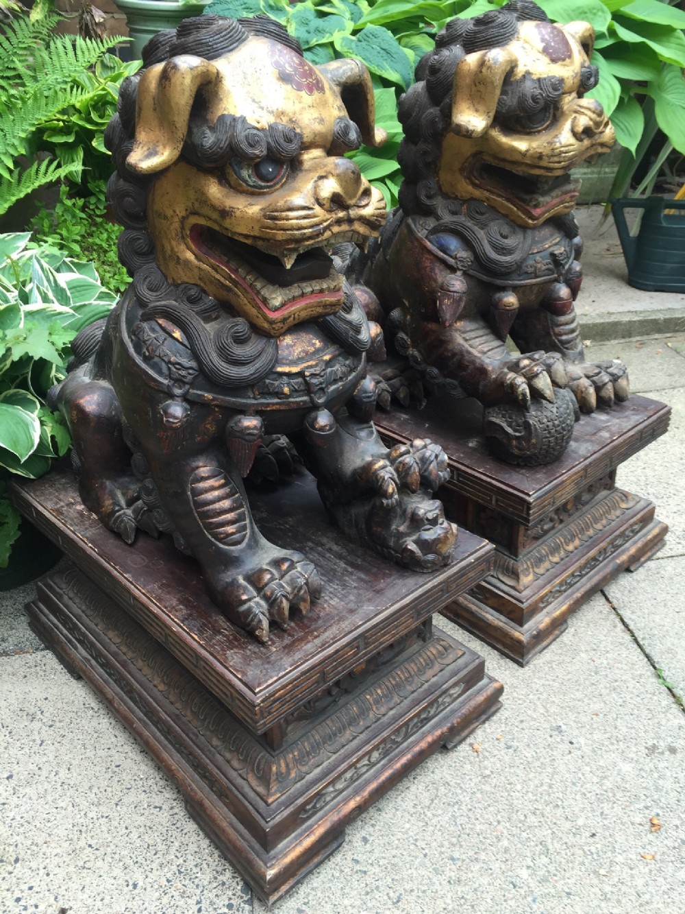 pair of large and impressive late c19th early c20th chinese carved wood polychrome paint and gilt decorated 'dogs of foo'