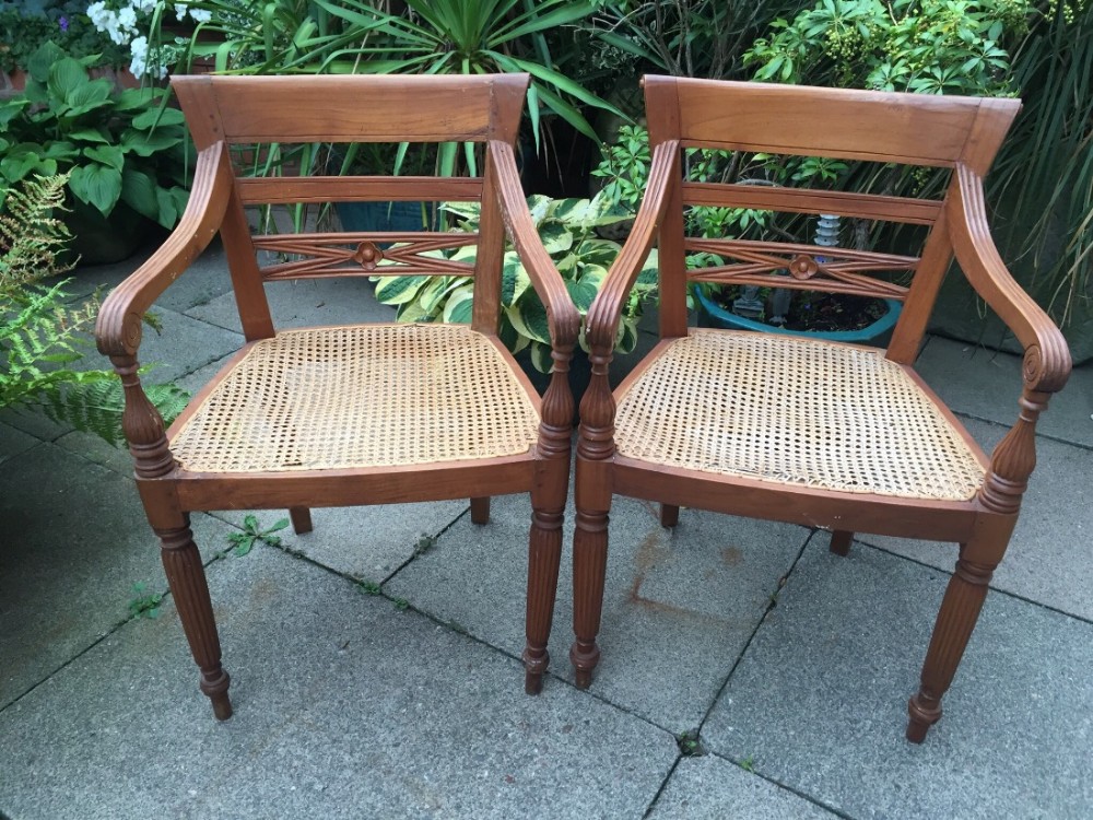 pair of early c20th dutch colonial style teak armchairs of early c19th design