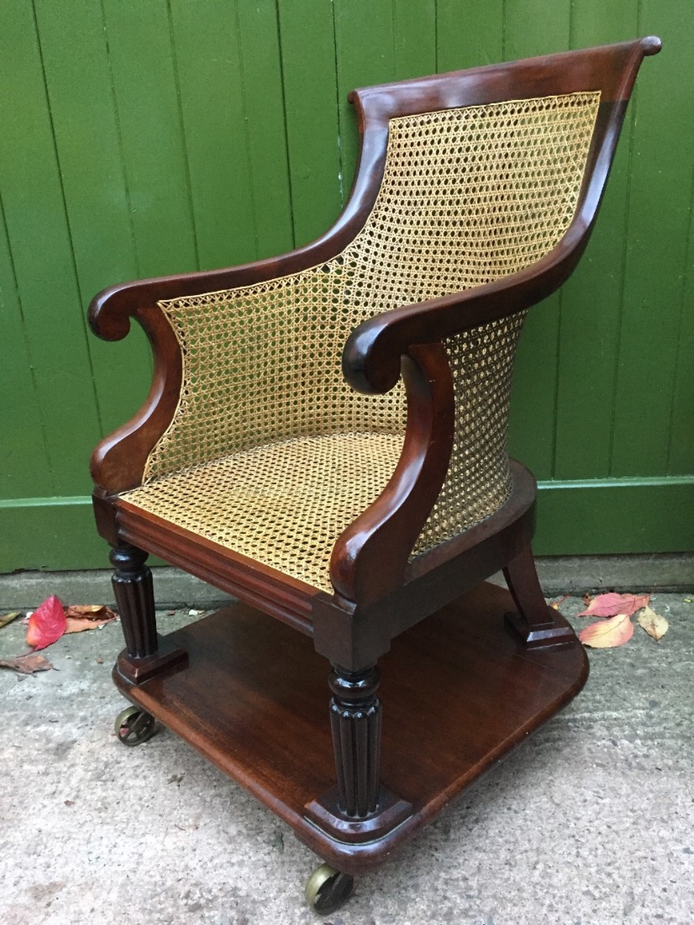 early c19th george iv period mahogany framed gentlemans bergere library or desk armchair of rare form