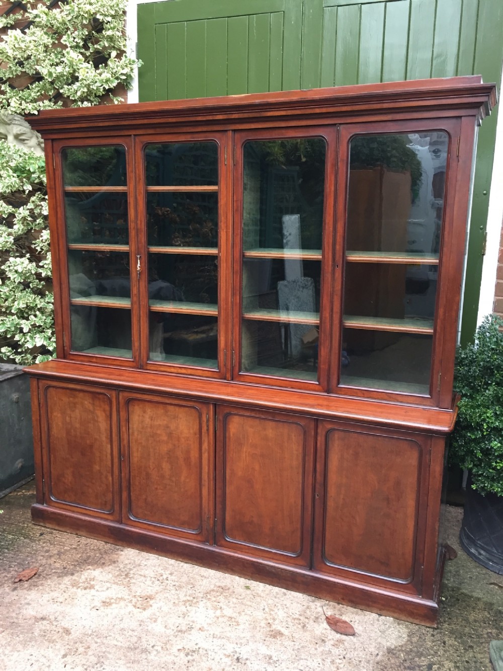 fine quality early c19th mahogany 4door library bookcase cabinet of elegant and compact proportions