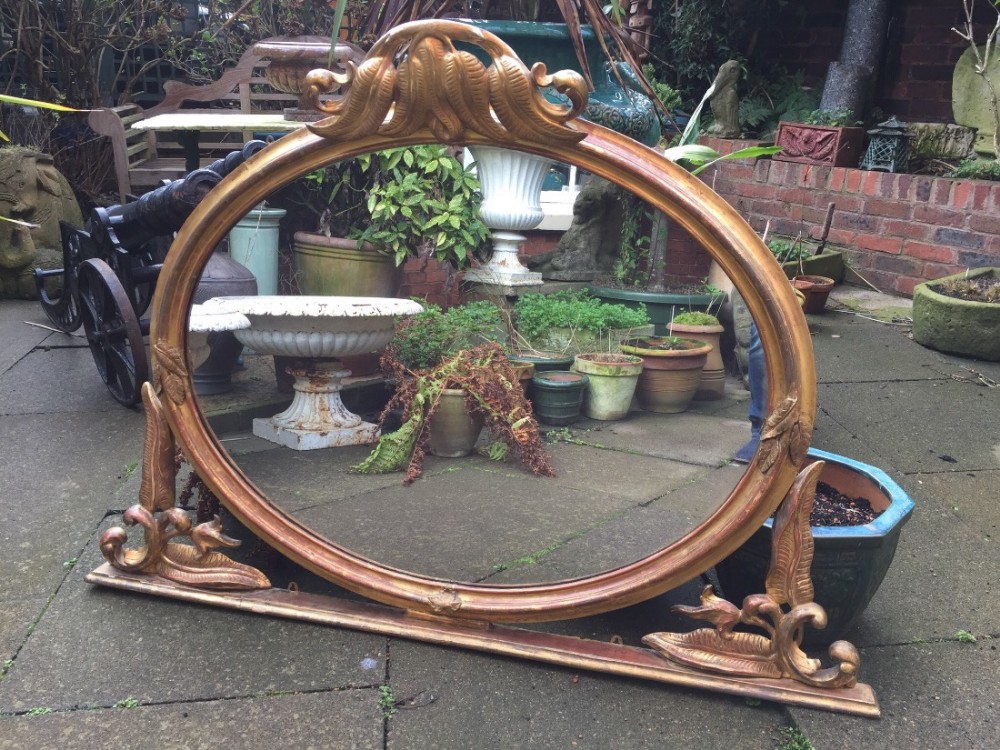 mid c19th carved giltwood ovalframed overmantel mirror with unusual carved fern motif decoration