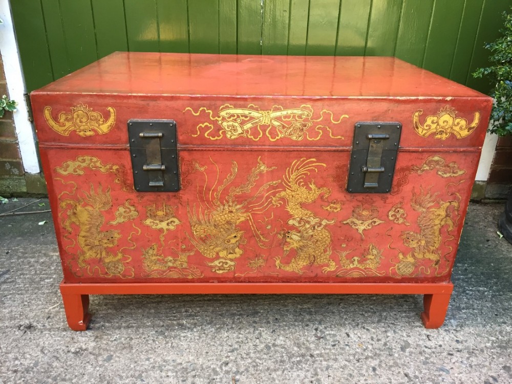 late c19th early c20th chinese red painted and lacquered leather chest or trunk on stand with gilt decoration