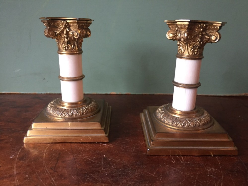 pair of late c19thearly c20th gilded ormolu and ivory column miniature candlesticks