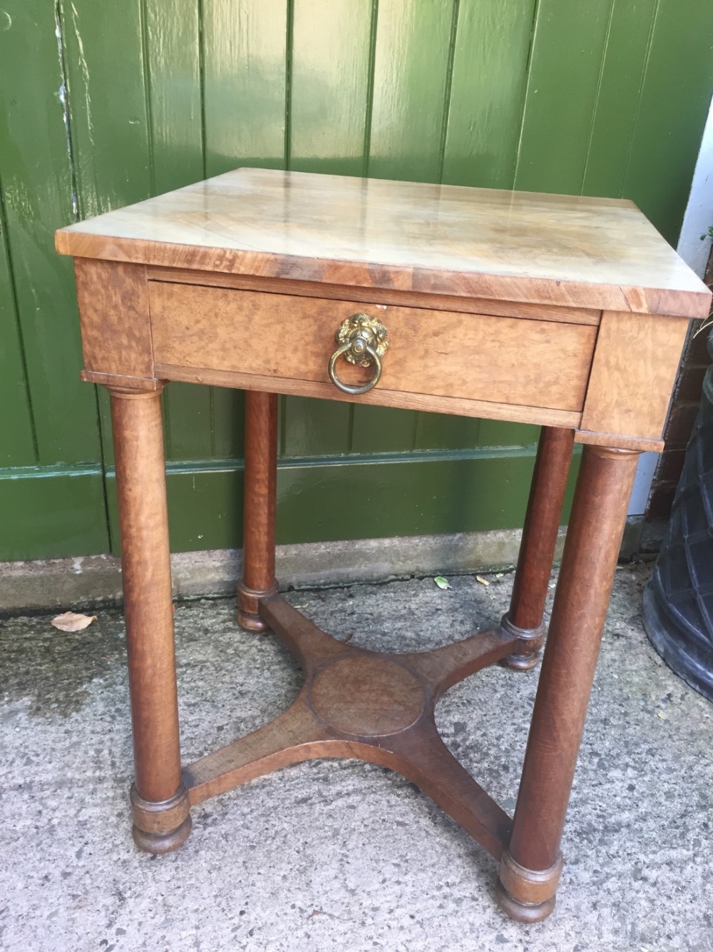 early c19th figured mahogany table of empire design with a pleasing faded patina