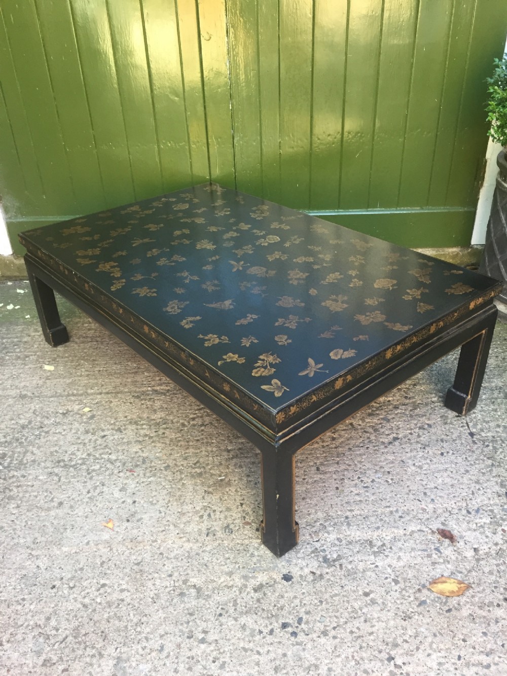 early c20th chinoiserie style black and gold lacquered low coffee table