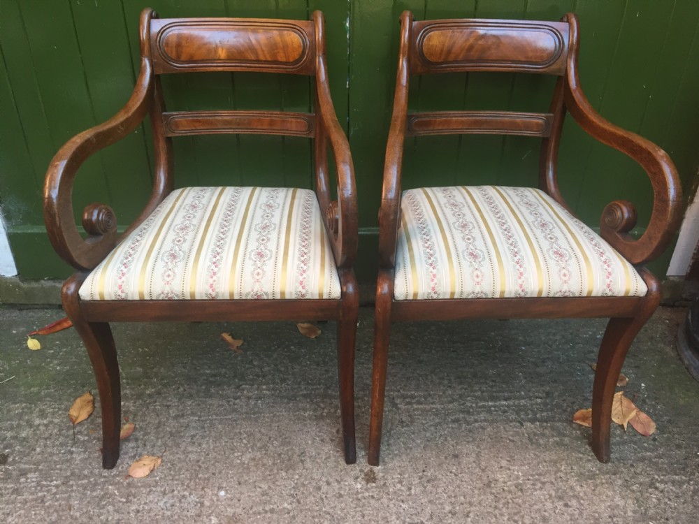 pair of early c19th regency period mahogany sabreleg armchairs