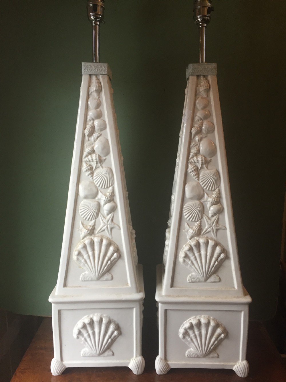 highly decorative pair of early c20th italian pottery lamps of obelisk form with raised 'seashell' decoration