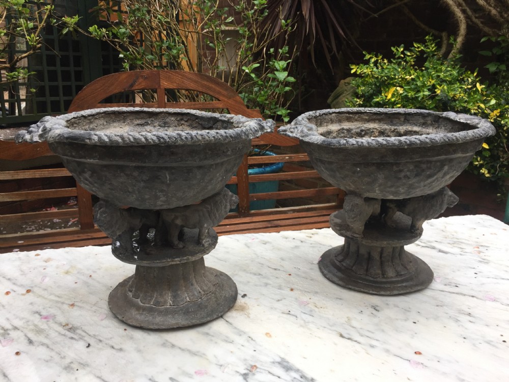 pair of early c19th lead planters or jardinieres of tazza form raised on unusual triple pacing lion supports