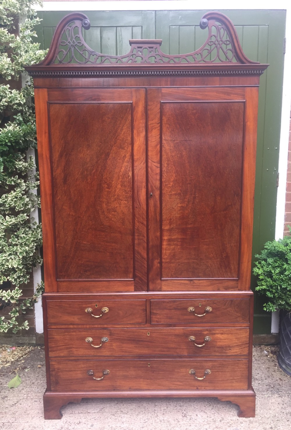rare george iii chippendale period and design padouk and mahogany linenpress or wardrobe with open fretwork swanneck pediment cornice