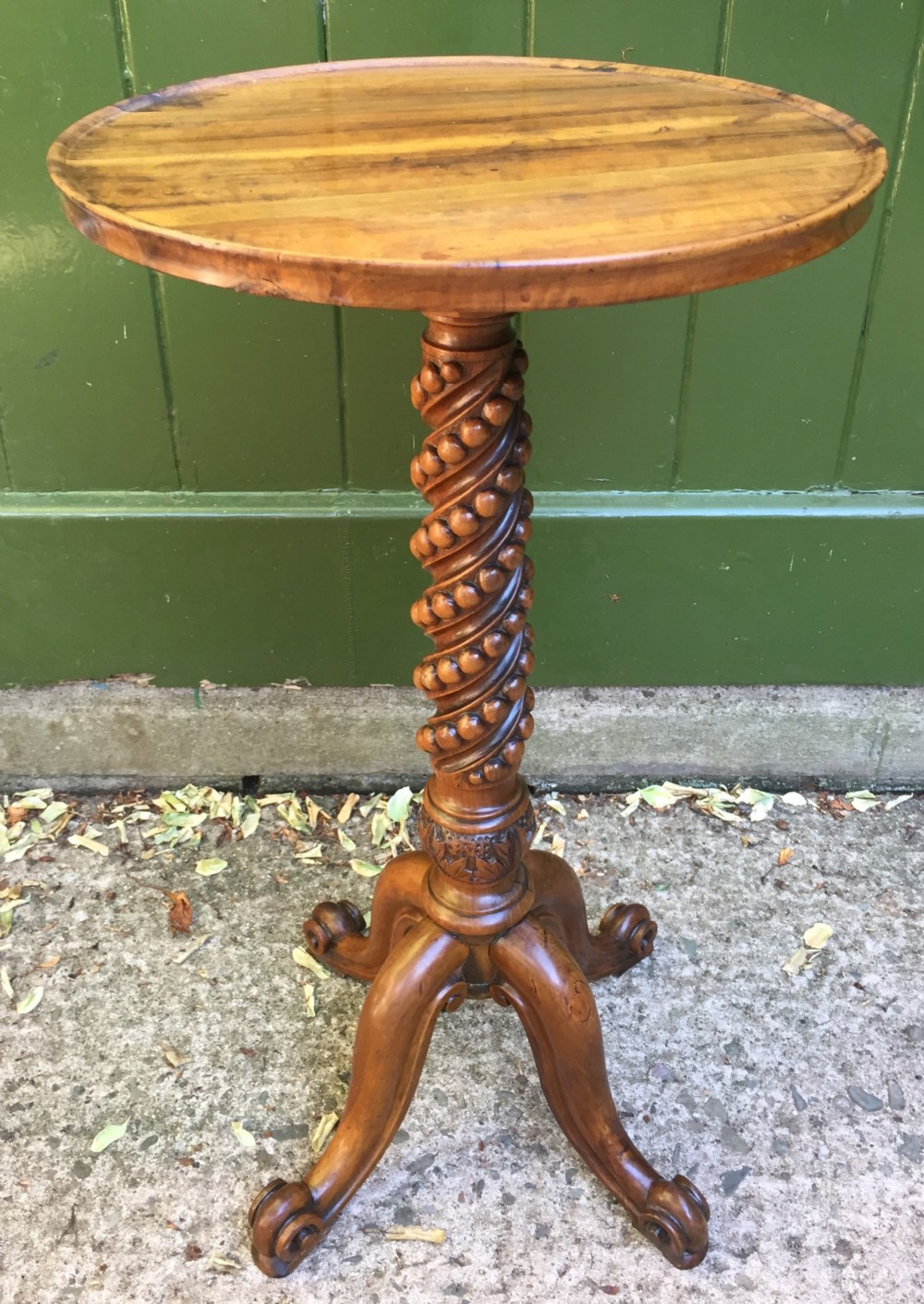 rare mid c19th olivewood wine table or candlestand on a quadruple support base