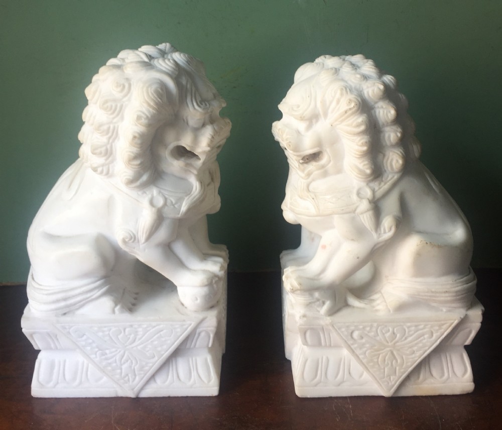 pair of early c20th chinese carved white marble temple guardian lion dogs