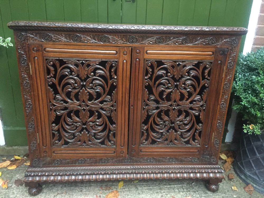 mid c19th angloindian carved padauk or rosewood dwarf bookcase or side cabinet