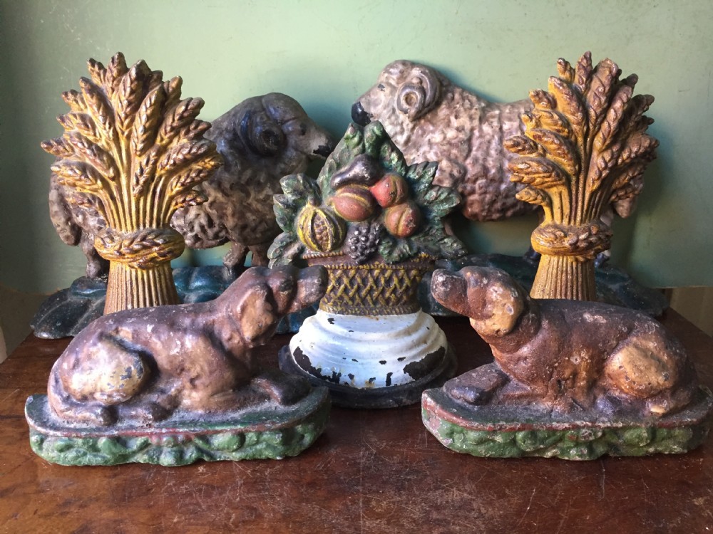 collection of decorative c19th castiron doorstops all in their apparently contemporaneous or original polychrome paint finishes probably american