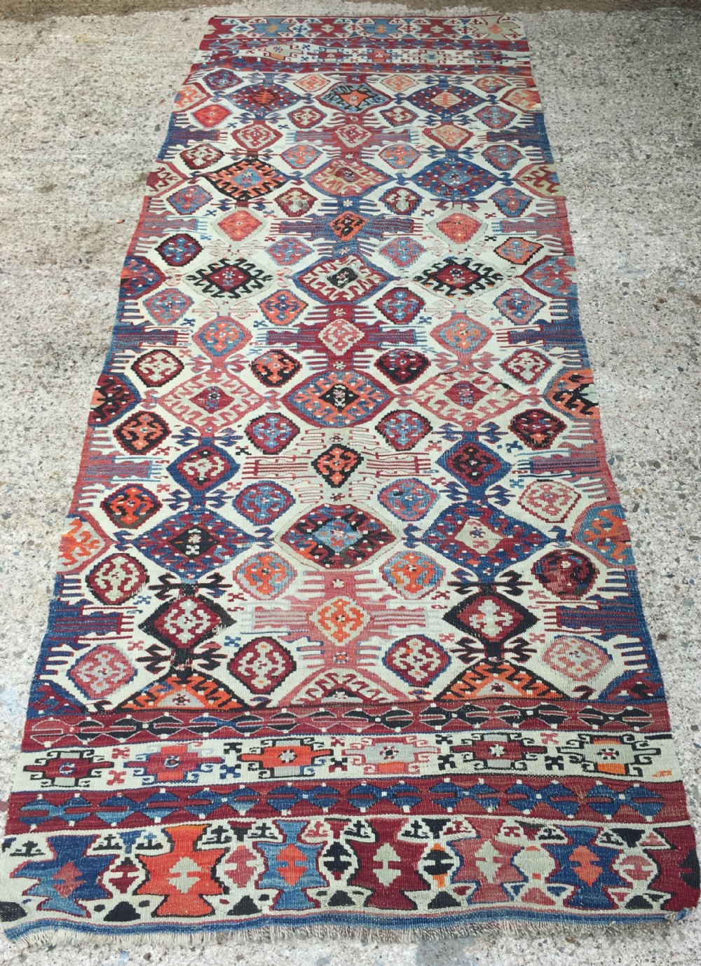 late c19th early c20th kilim rug of traditional geometric pattern in beautifully subtle colours
