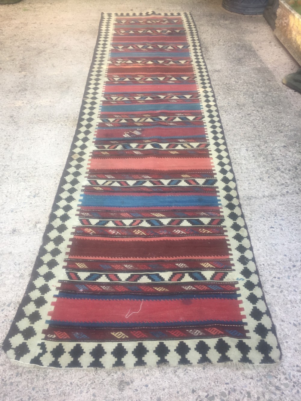 late c19th early c20th kilim rug of traditional geometric pattern with bands of multicoloured design