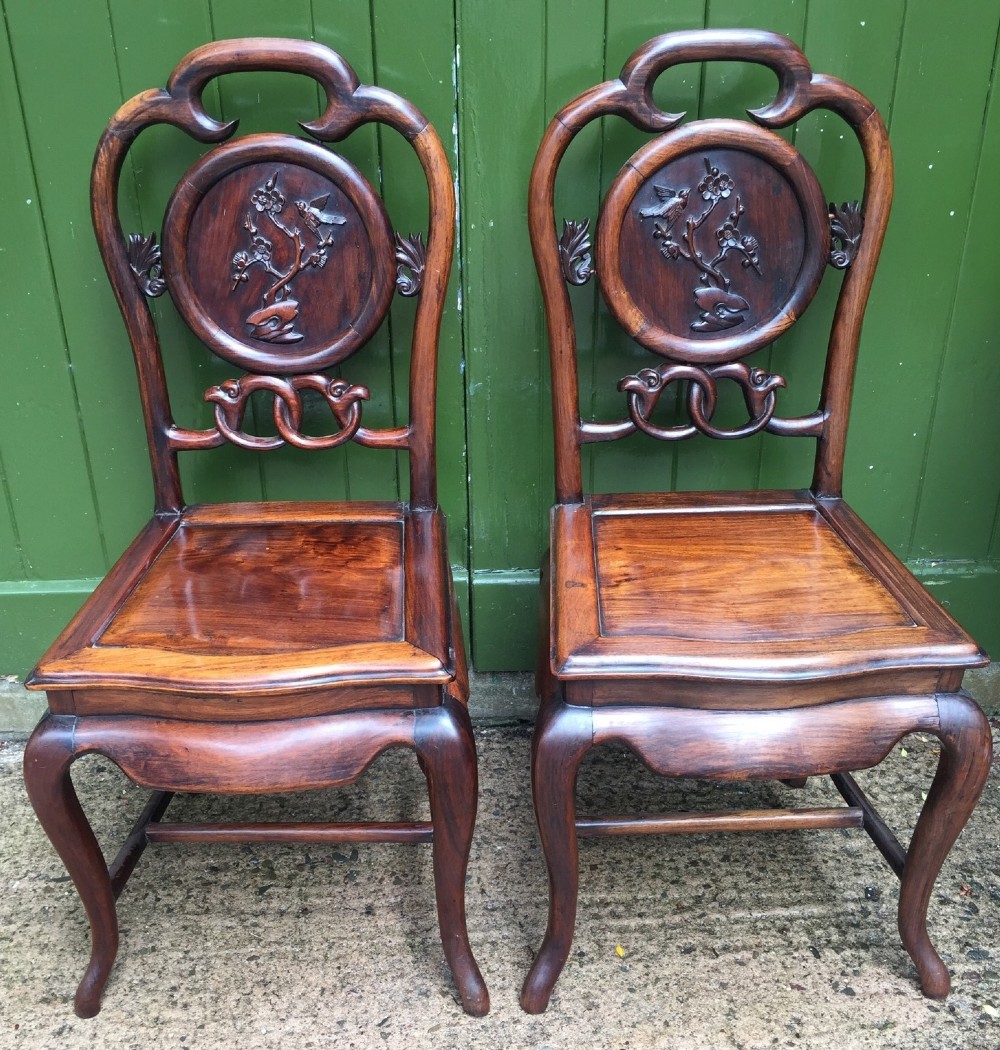 pair of late c19th chinese qing dynasty carved hardwood hall or side chairs
