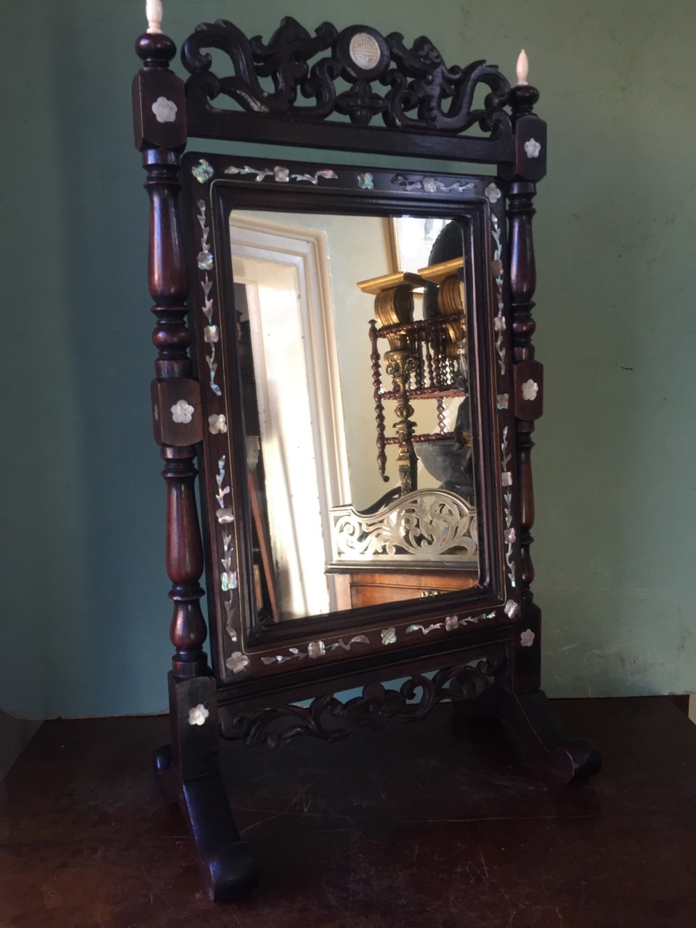 interesting mid c19th chinese miniature hardwoodframed vanity mirror with 'mother of pearl' inlay and ivory finials