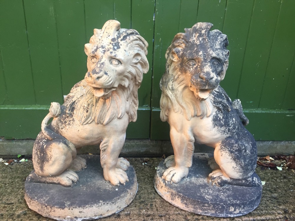 fine and decorative pair of c19th weathered terracotta sitting lions in the c18th anthropomorphic taste