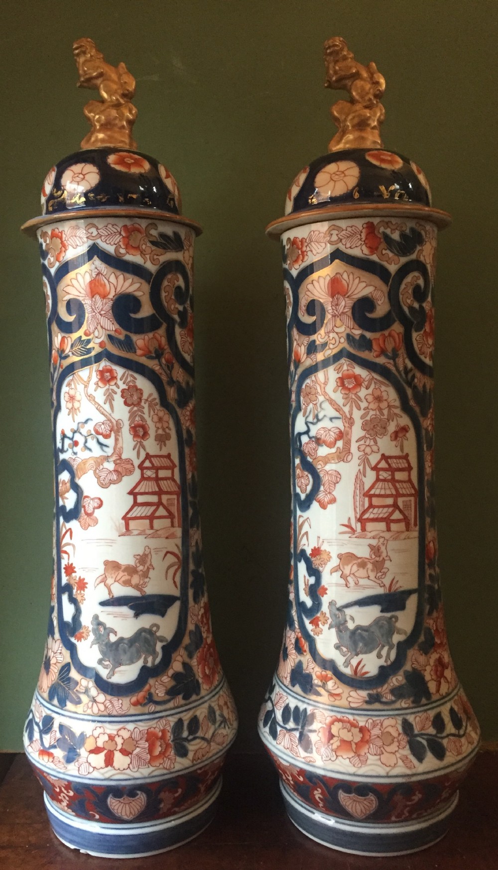 fine pair of mid c19th japanese imari pattern porcelain lidded vases of unusual shape and form