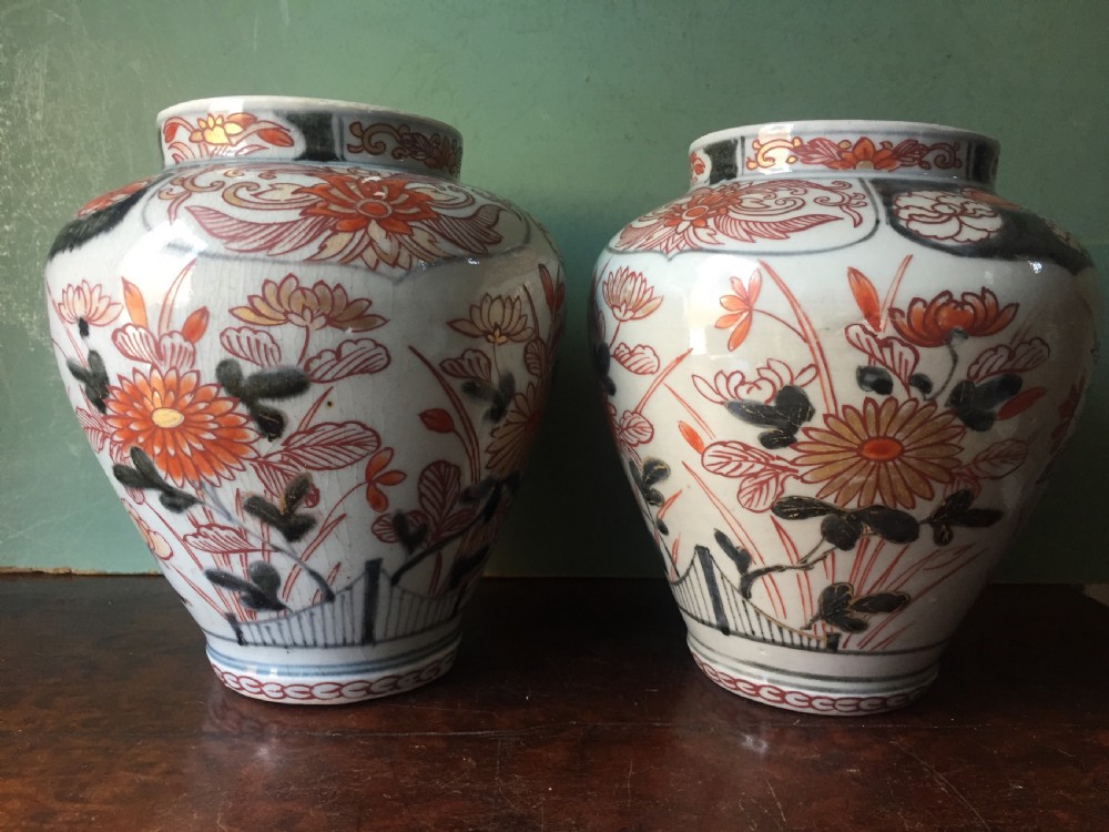 pair of late c17th early c18th edo period japanese porcelain vases in the imari palette