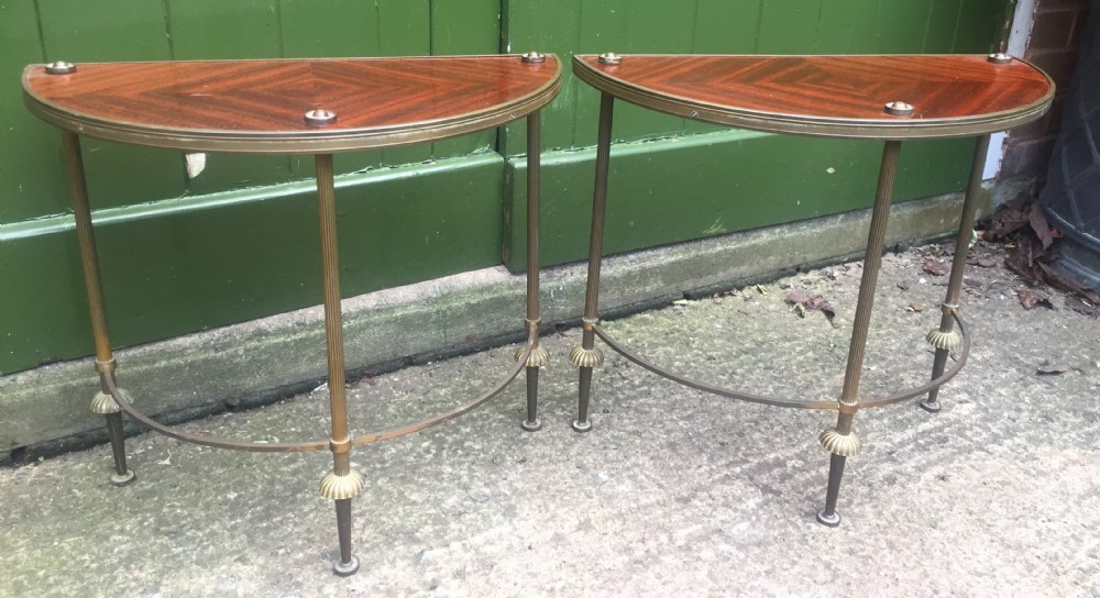 pair of early c20th brassframed semicircular drinks or end tables with quarterveneered mahogany tops