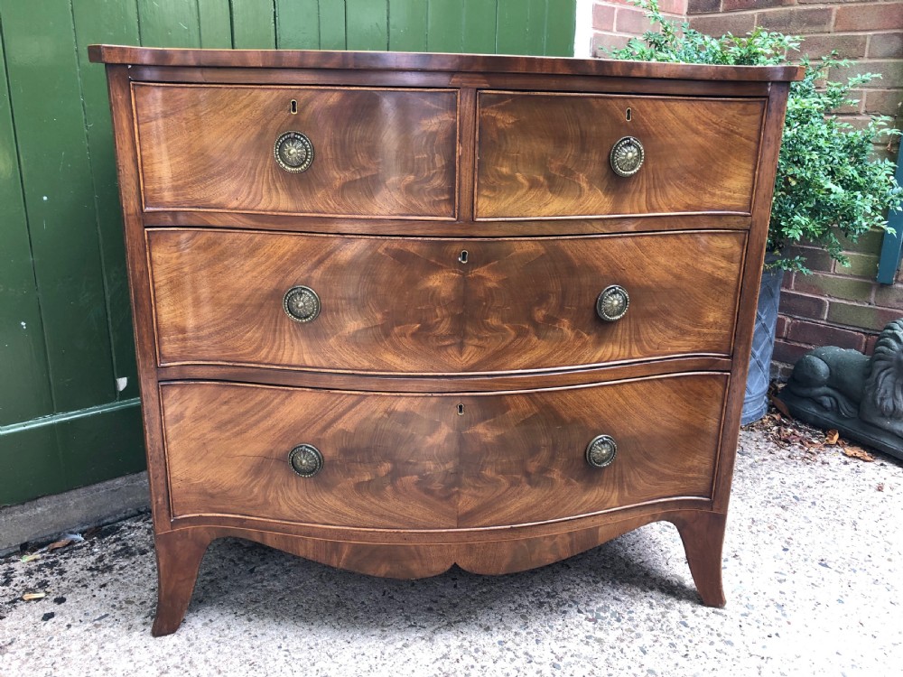 early c19th regency period mahogany serpentineoutline chest of drawers