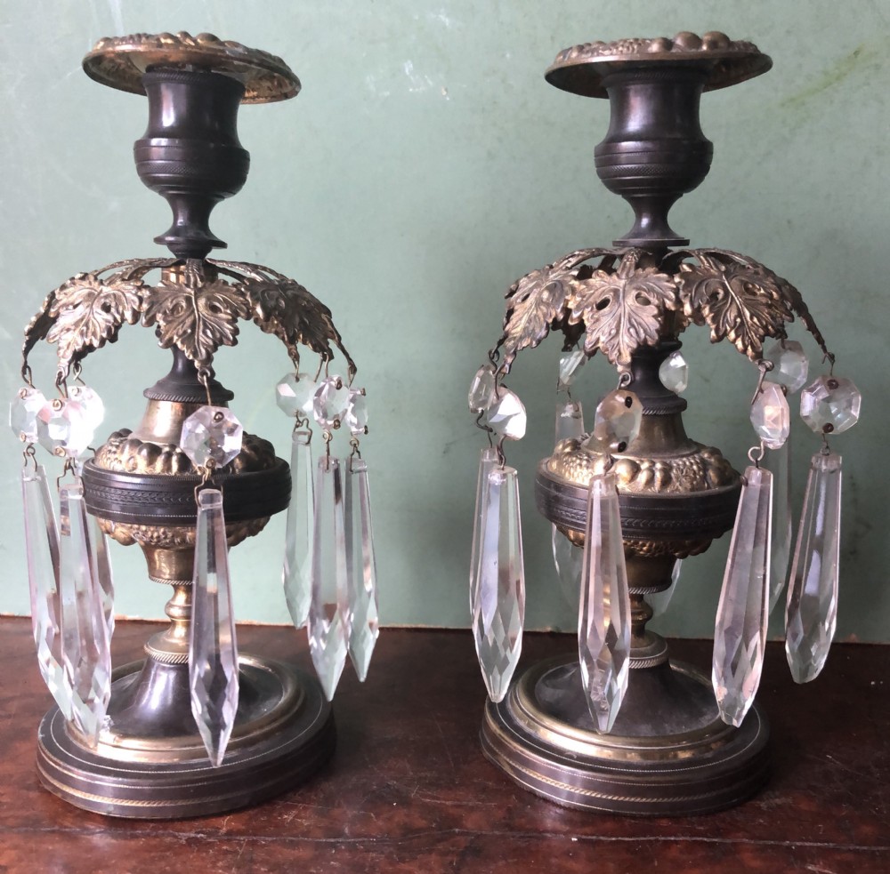pair of early c19th regency period patinated and gilded bronze lustre candlesticks