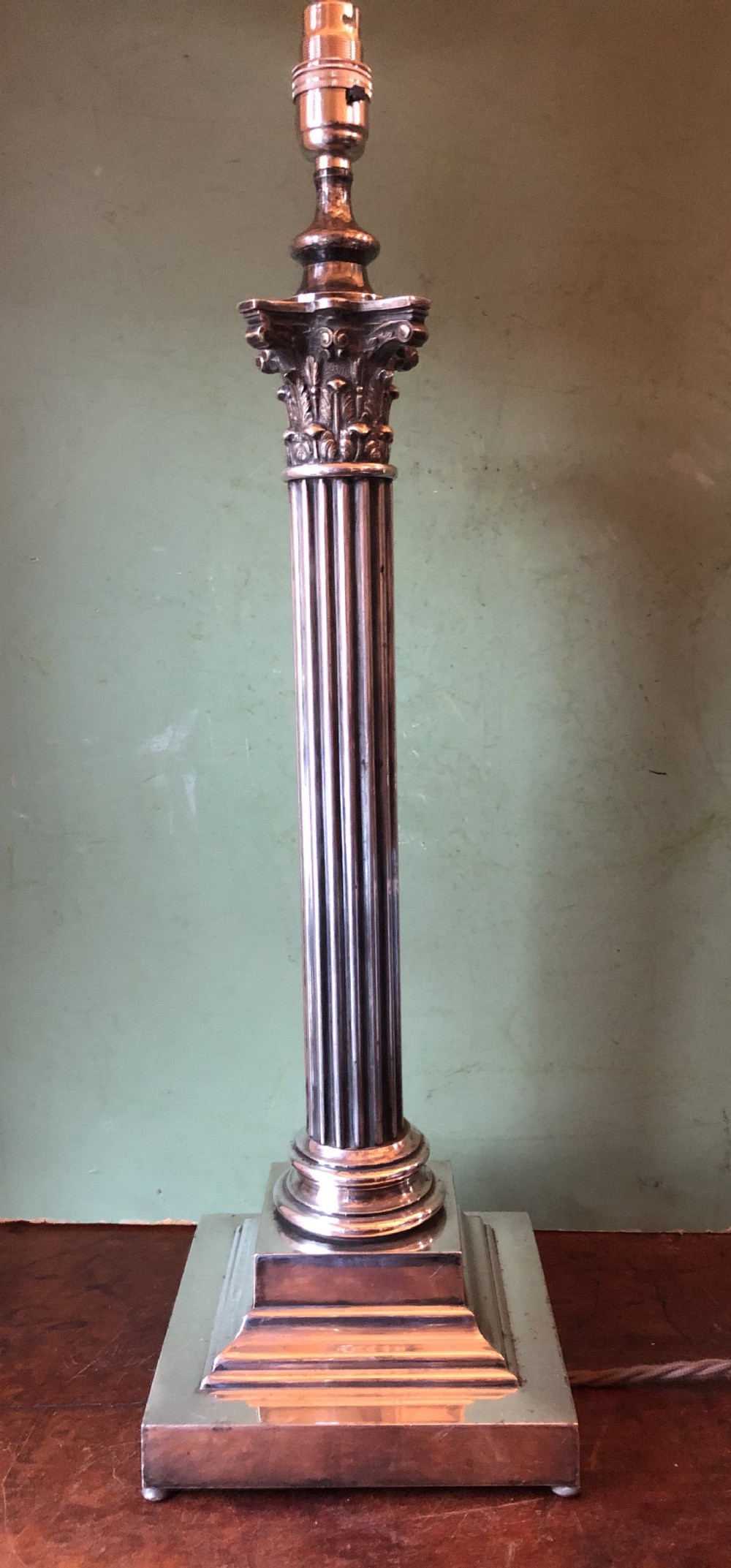 late c19th early c20th silverplated table lamp of classical reeded column form with a corinthian capital top