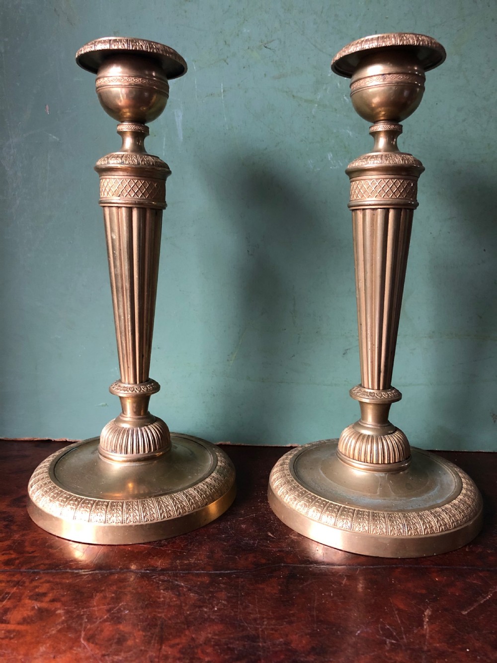 pair of early c19th french charles x period ormolu bronze candlesticks