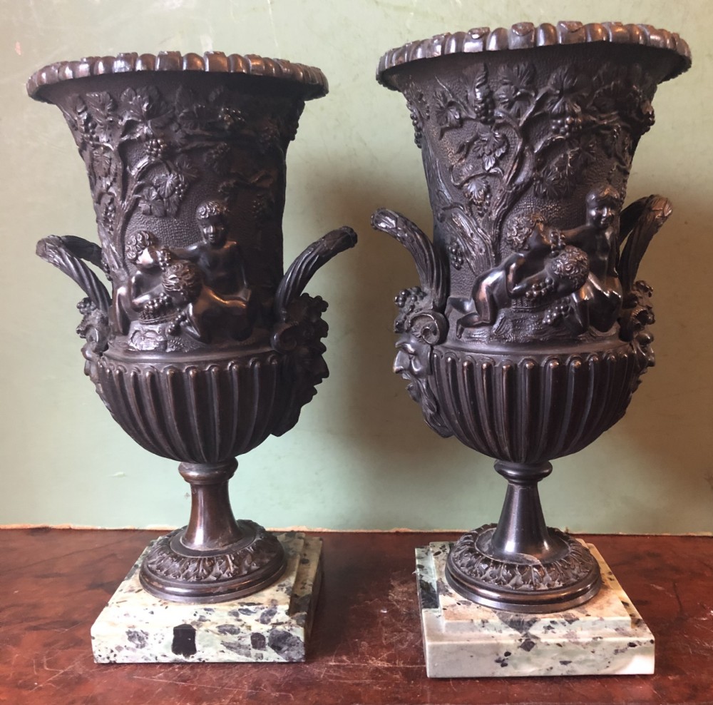 pair of mid c19th italian classical design bronze vases decorated with bacchanalian scenes