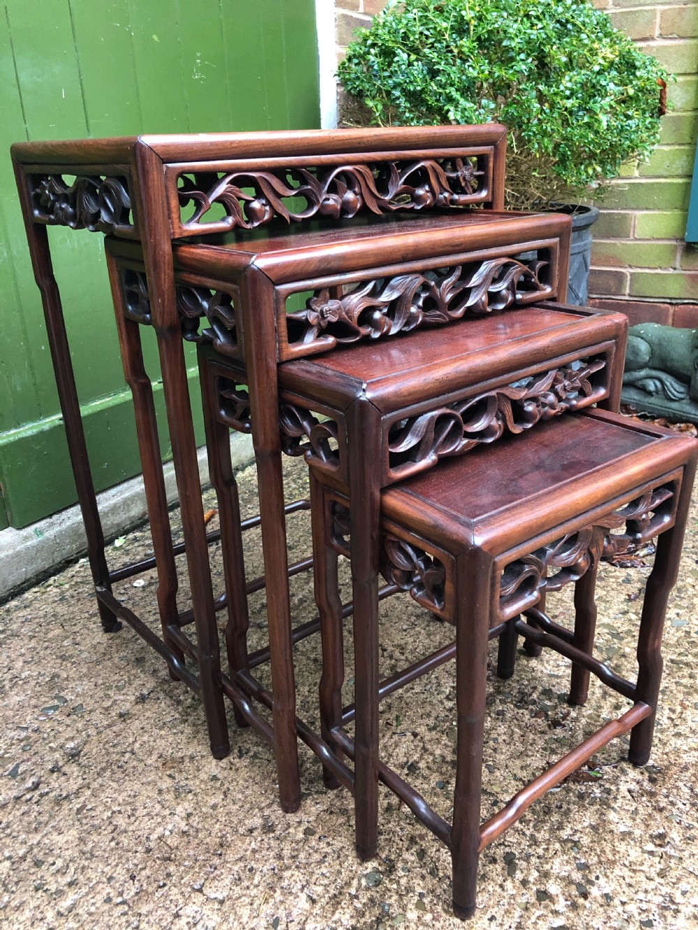 set of 4 late c19th early c20th chinese qing dynasty carved hardwood nesting tables