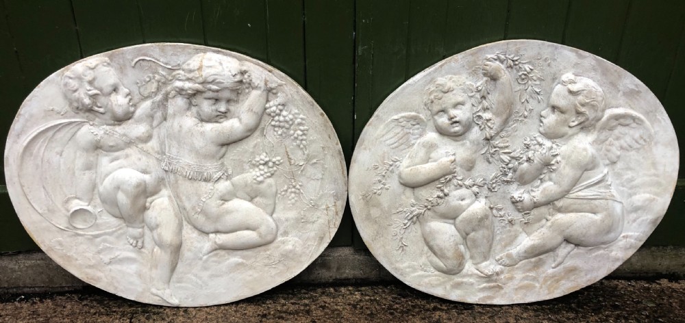 pair of late c19th early c20th oval classical style basrelief plaster panels
