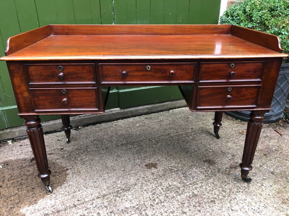 early c19th george iv period mahogany kneehole writing table in the manner of gillows of lancaster and london