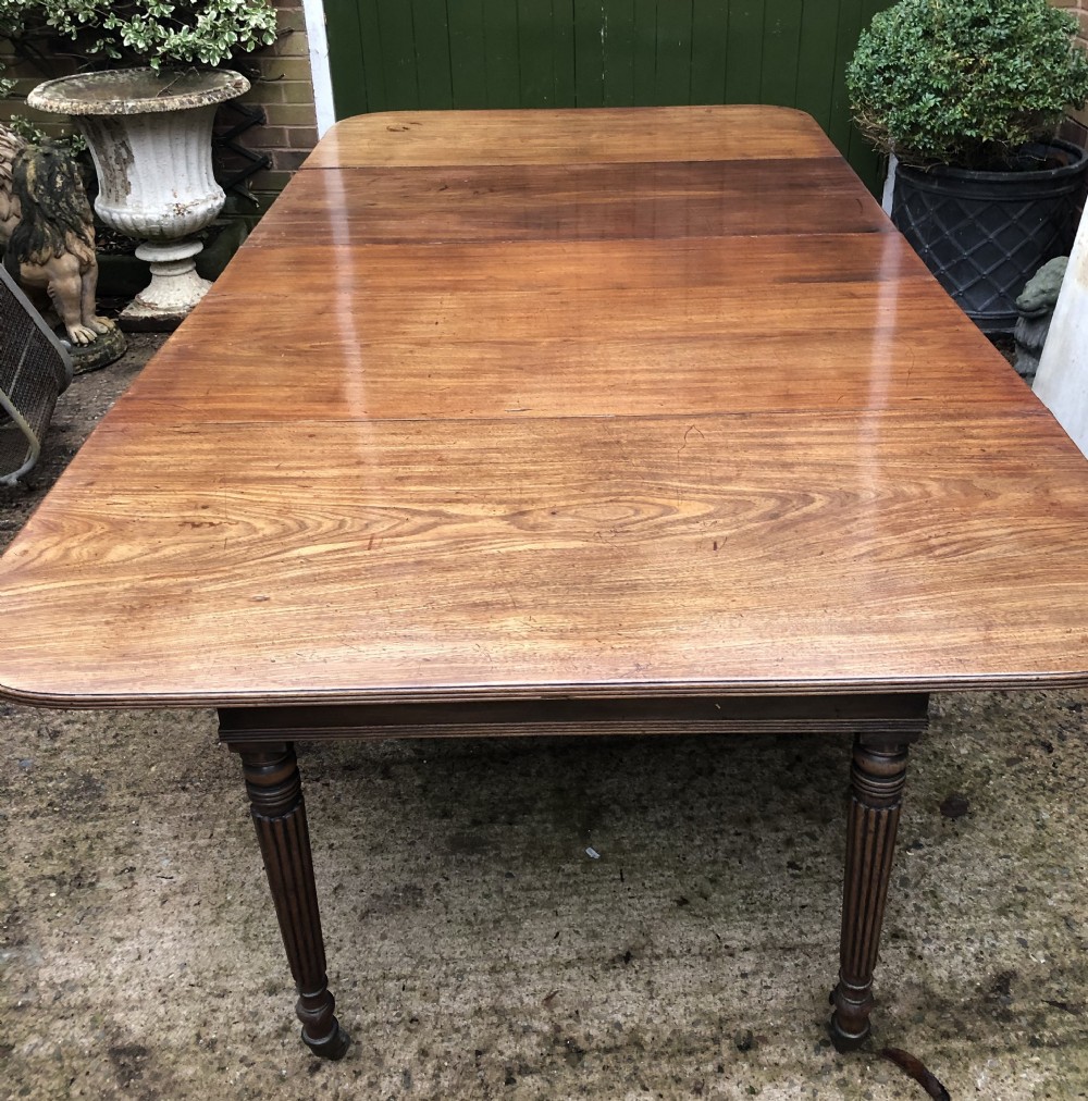 early c19th late george iii period mahogany extending dining table of unusual format