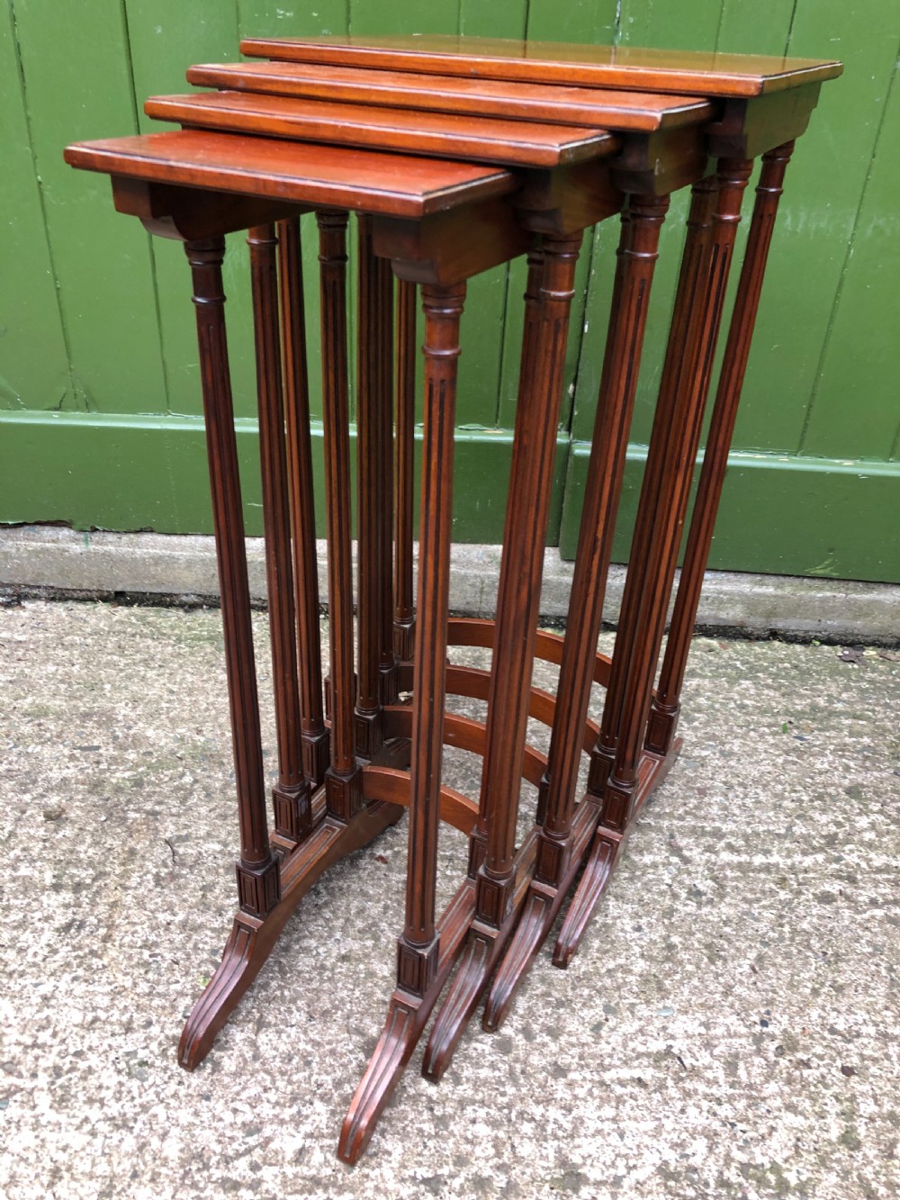 early c20th quartetto of mahogany nesting tables of compact scale