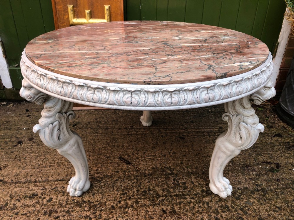 late c19th decorated circular carved carved table with marble top on ancient roman style lion monopodia supports