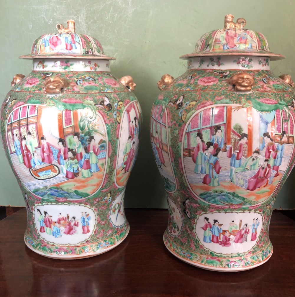 pair of c19th chinese cantonese porcelain famille rose enamel decorated vases and covers
