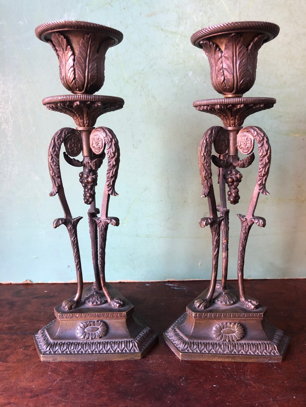 finely cast pair of early c19th regency period bronze candlesticks of classical athenienne form