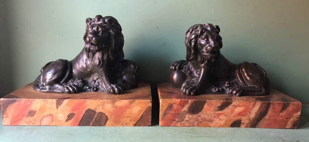 fine pair of c18th italian bronze lions mounted on faux marble decorated plinth bases
