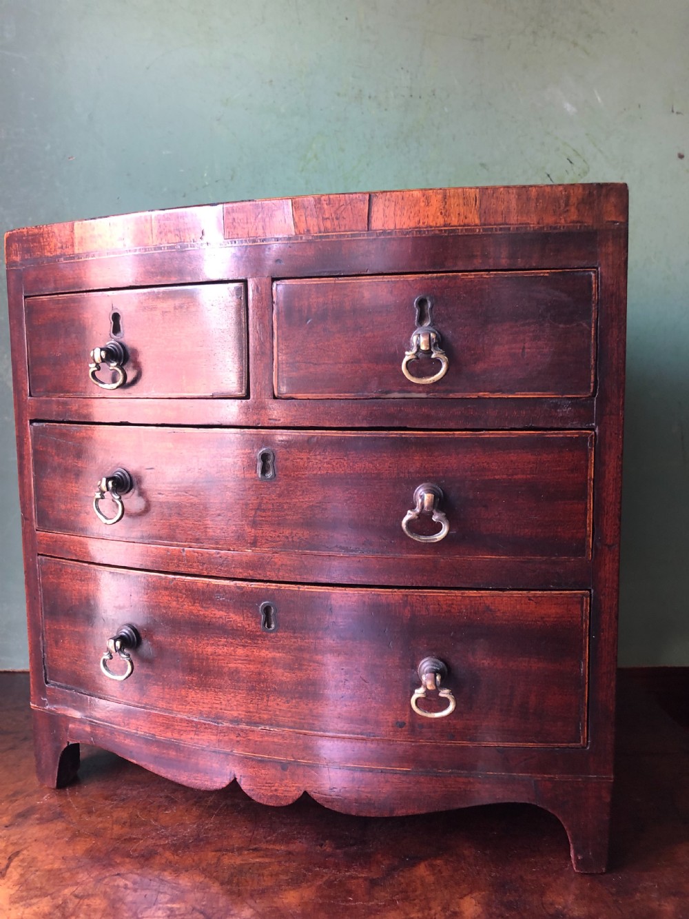 early c19th late george iii period miniature mahogany bowfront chest of drawers