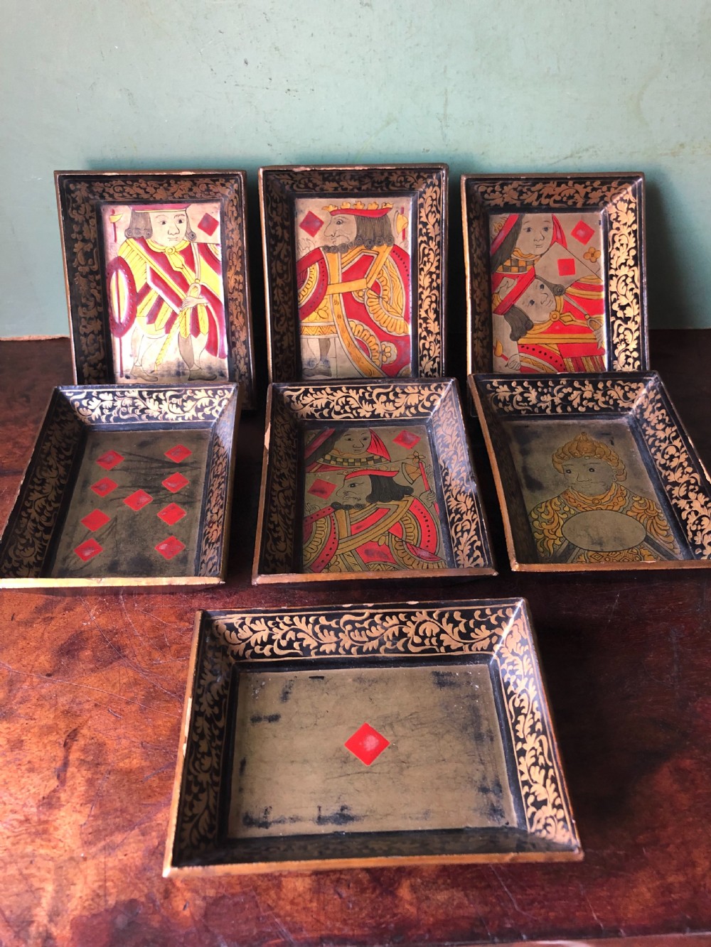 interesting and decorative set of 7 mid c19th chinese export lacquer miniature trays for holding gambling chips
